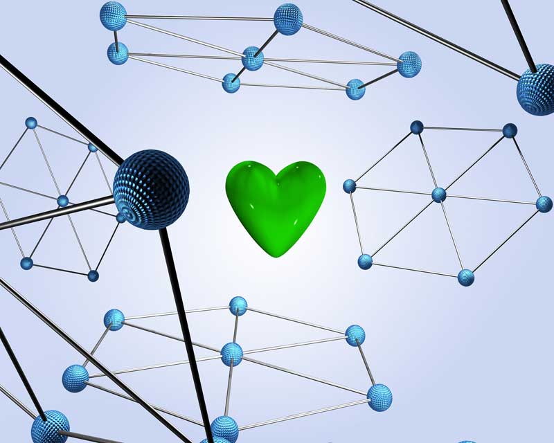 Some pieces of technology and a green heart in the middle