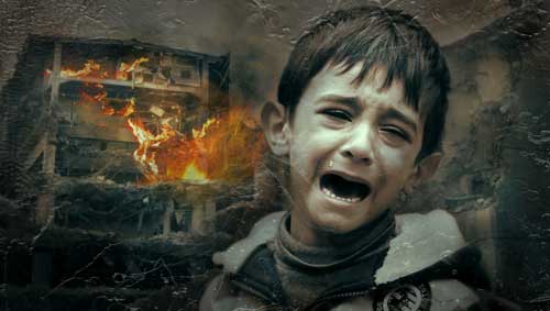 A boy crying, with a scene of destruction behind him